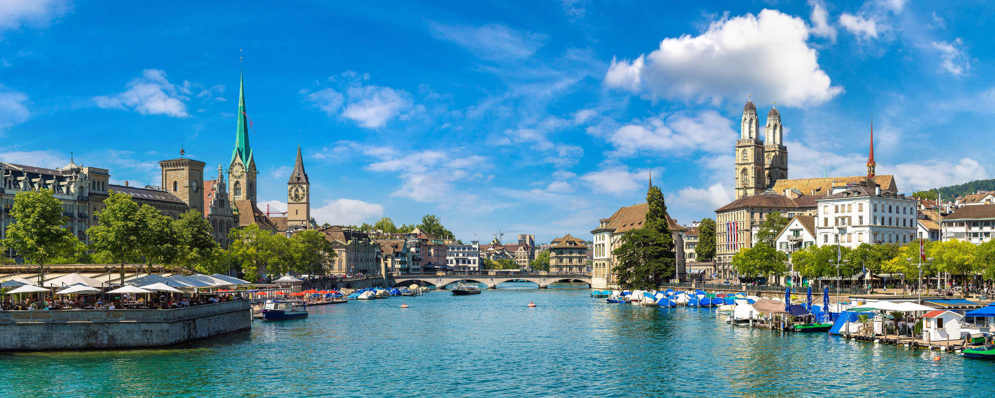 River view of Fraumunster and Grossmunster churches in Zurich, Switzerland.